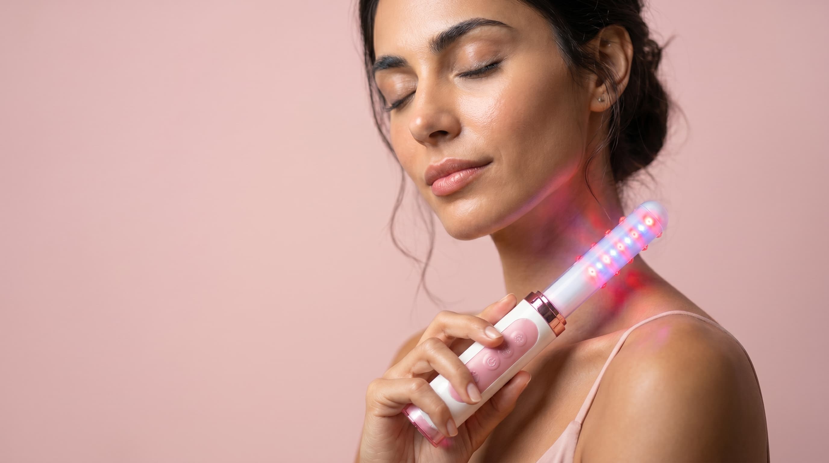 Model holding the MyVibe.doctor device